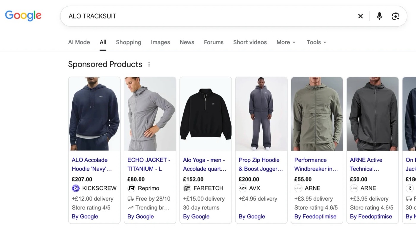 Google search results for a tracksuit, with a row of Sponsored Products showing product photos, prices, retailers and delivery details